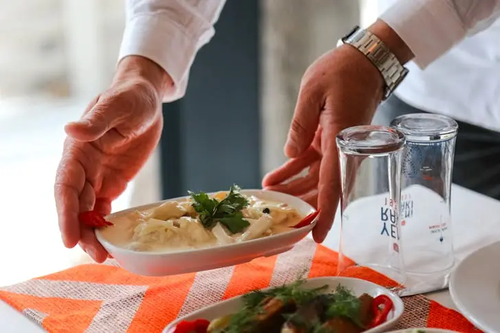 Weirdest Foods - A person deliver bowl of salad.